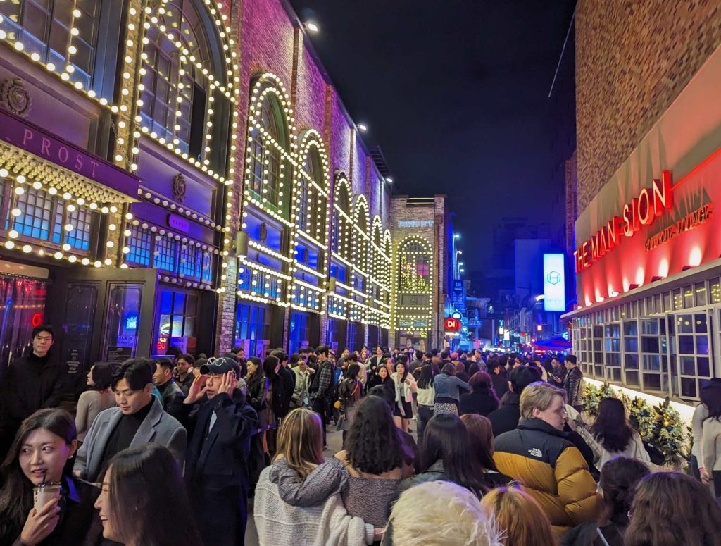 Beaming lights of Prost nightclub in Itaewon with long queue outside